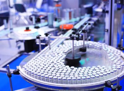 Factory for the production of medicines, glass bottles on the conveyor